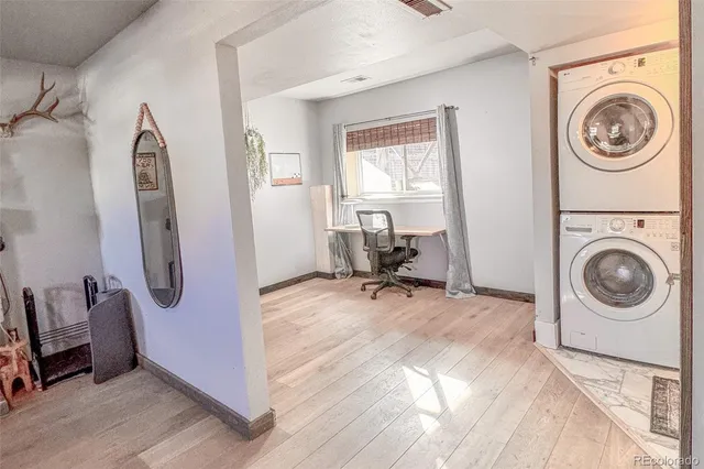 a utility room with sink dryer and washer