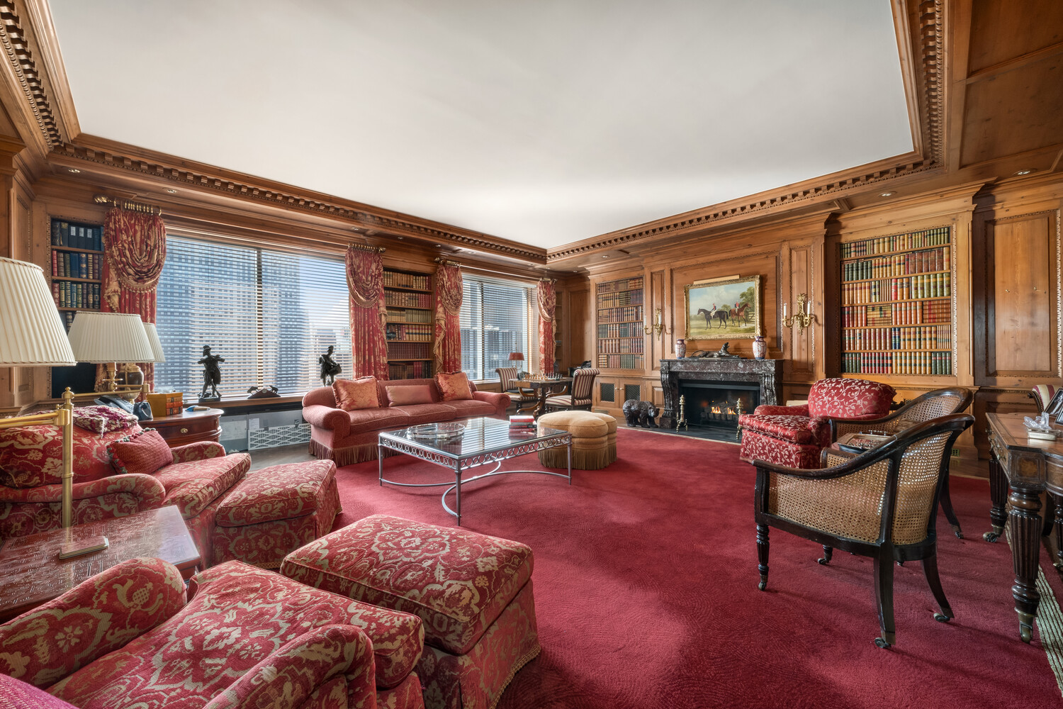 15 West 53rd Street, Unit PH Manhattan, NY 10019 - Photo 9 of 28 a living room with furniture a fireplace and a large window