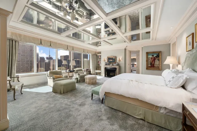 a bed room with a bed and large window