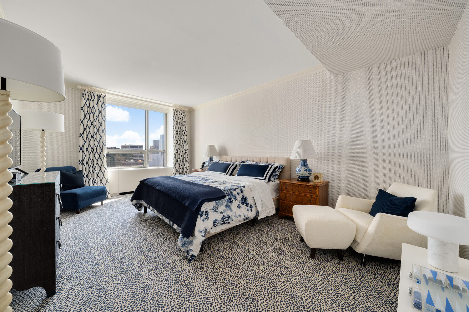 15 West 53rd Street, Unit PH Manhattan, NY 10019 - Photo 22 of 28 a spacious bedroom with two beds and a window