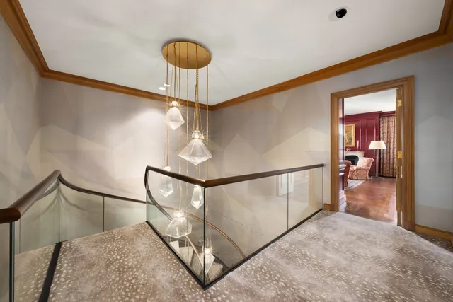 a spacious bedroom with two beds and a window