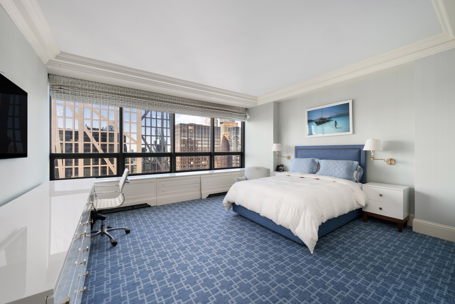 15 West 53rd Street, Unit PH Manhattan, NY 10019 - Photo 25 of 28 a spacious bedroom with a bed and a large window
