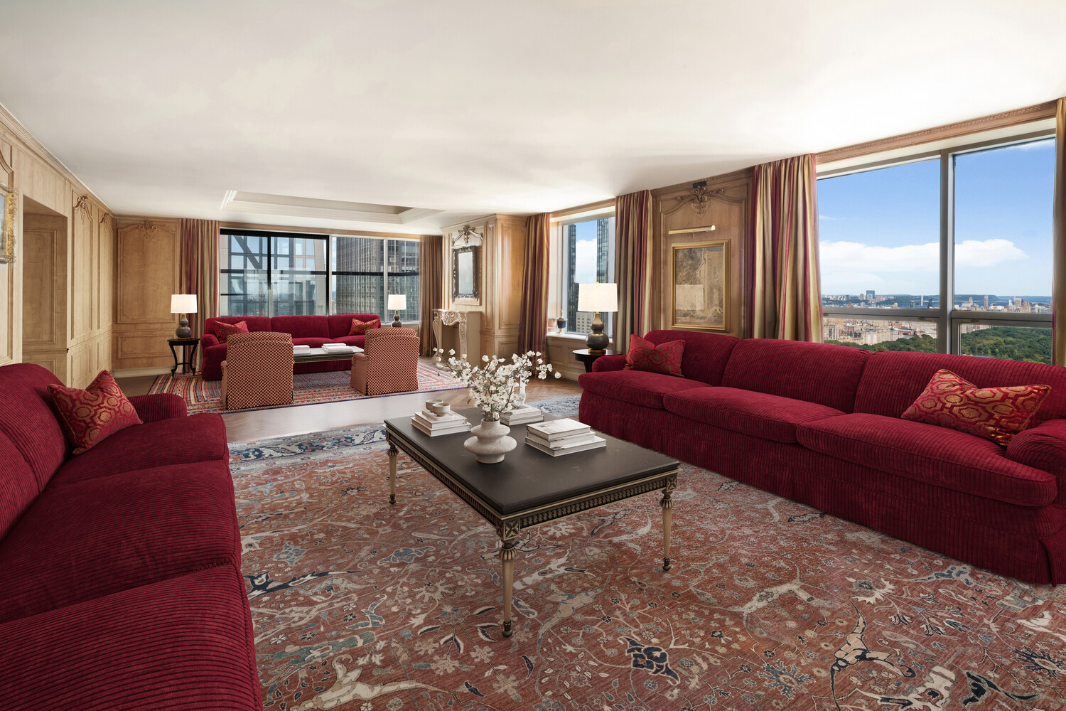 15 West 53rd Street, Unit PH Manhattan, NY 10019 - Photo 7 of 28 a living room with furniture and a large window