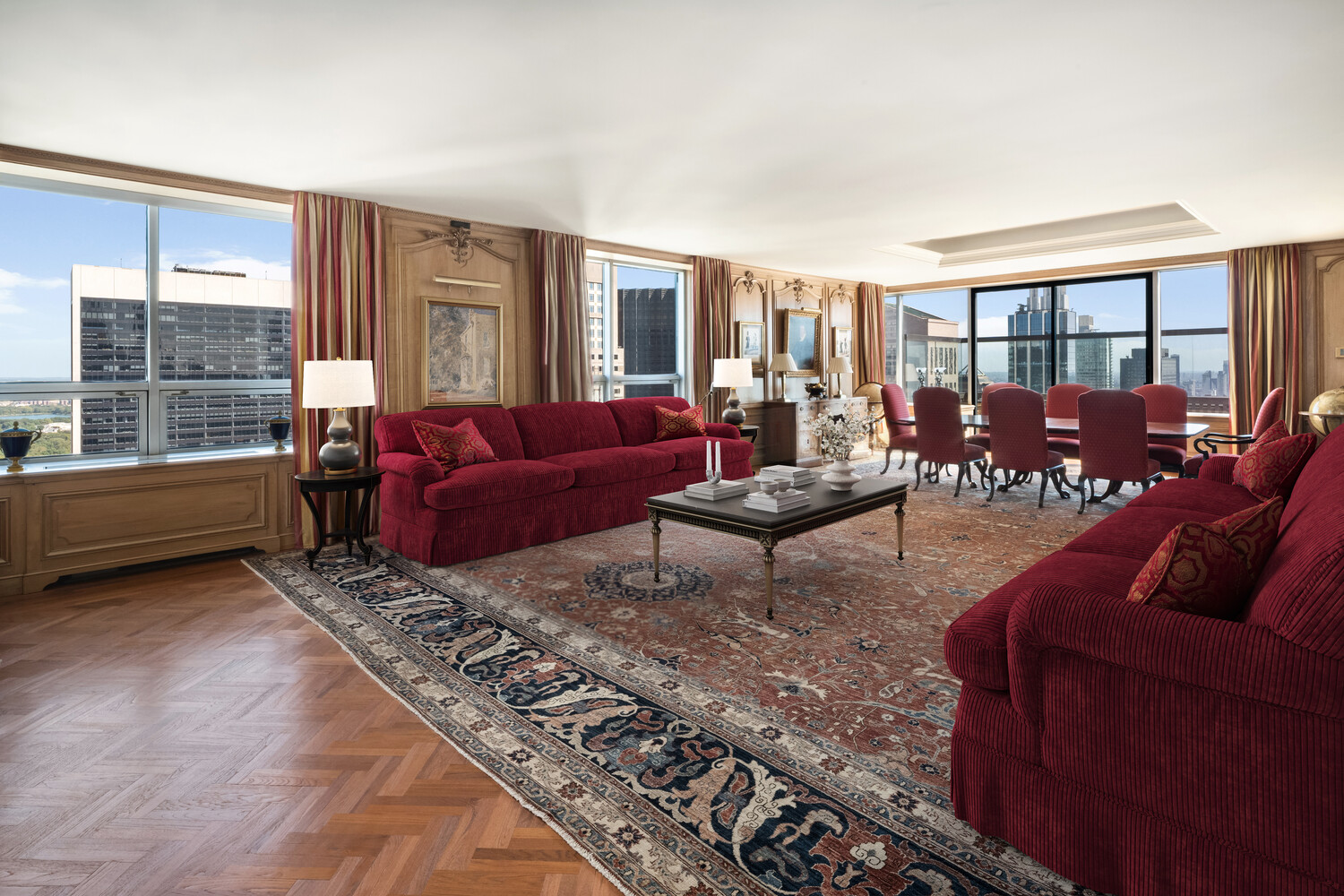 15 West 53rd Street, Unit PH Manhattan, NY 10019 - Photo 8 of 28 a living room with furniture and a large window