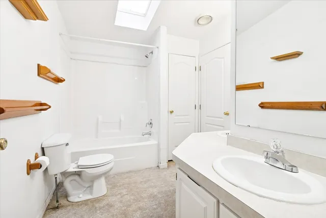 a bathroom with a toilet and a bathtub
