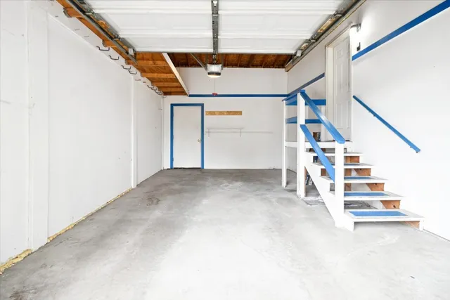 a view of a house with wooden deck