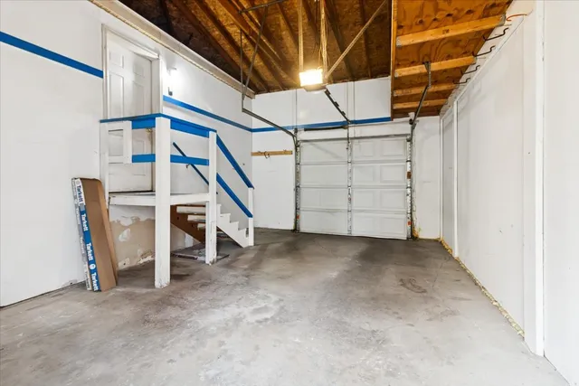 a view of small yard with wooden fence