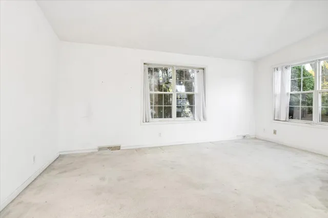 an empty room with windows