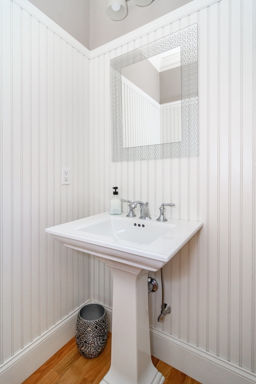 2 Hunters Lane Natick, MA 01760 - Photo 16 of 40 a bathroom with a sink and a mirror
