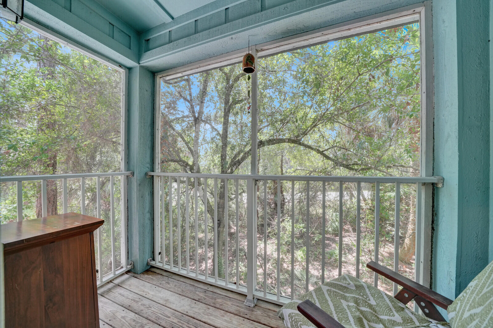 a view of a porch with wooden floor and outdoor space