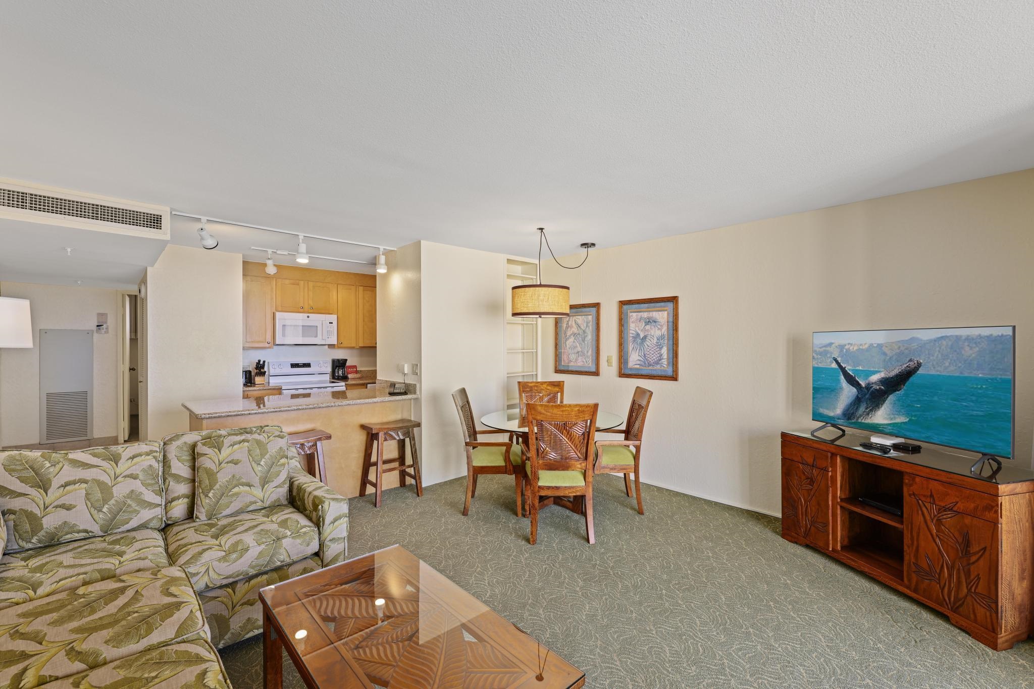 3445 Lower Honoapiilani Road, Unit 727 Lahaina, HI 96761 - Photo 13 of 42 a living room with furniture and a flat screen tv