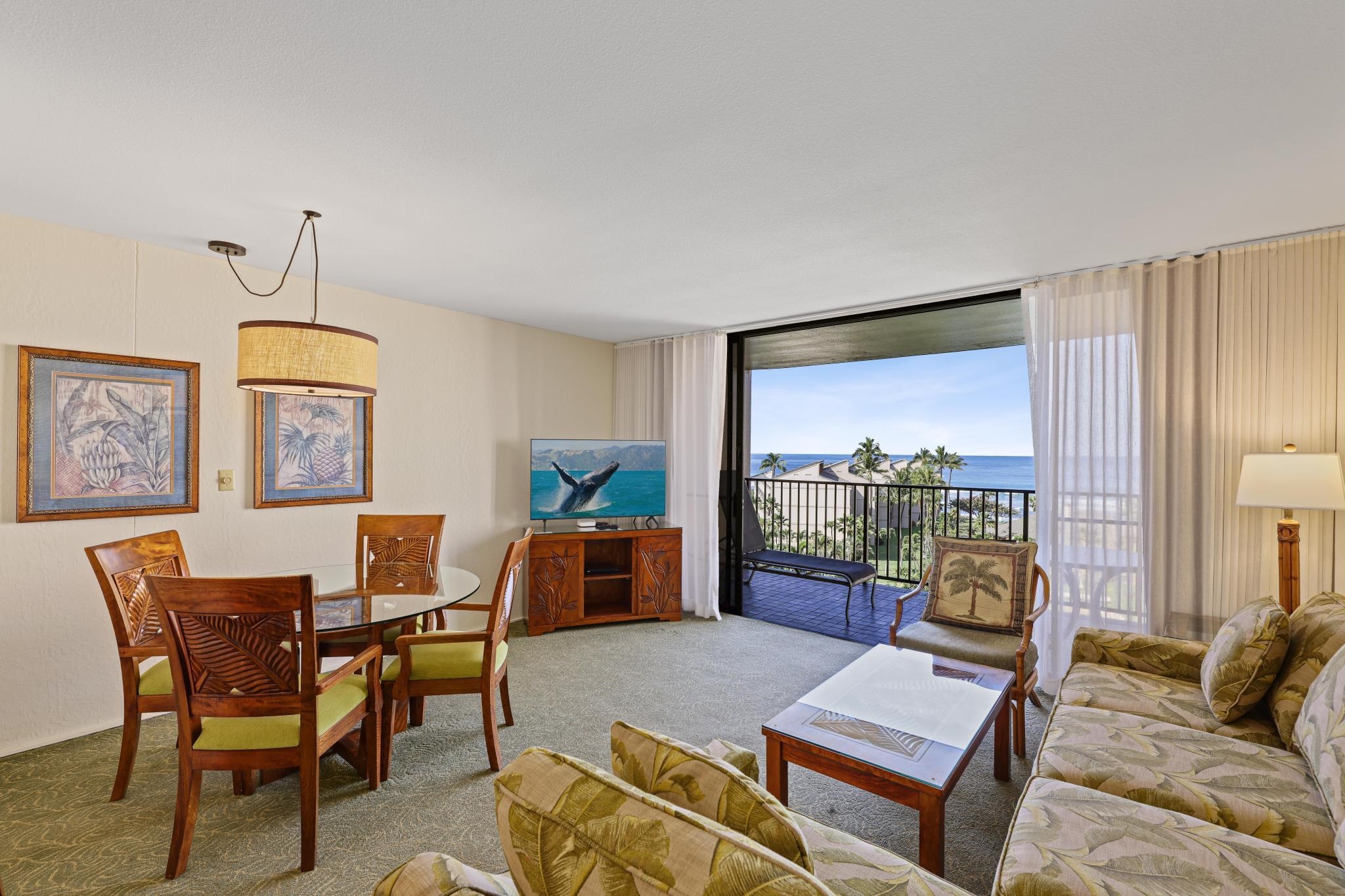 3445 Lower Honoapiilani Road, Unit 727 Lahaina, HI 96761 - Photo 7 of 42 a living room with furniture a rug and a large window