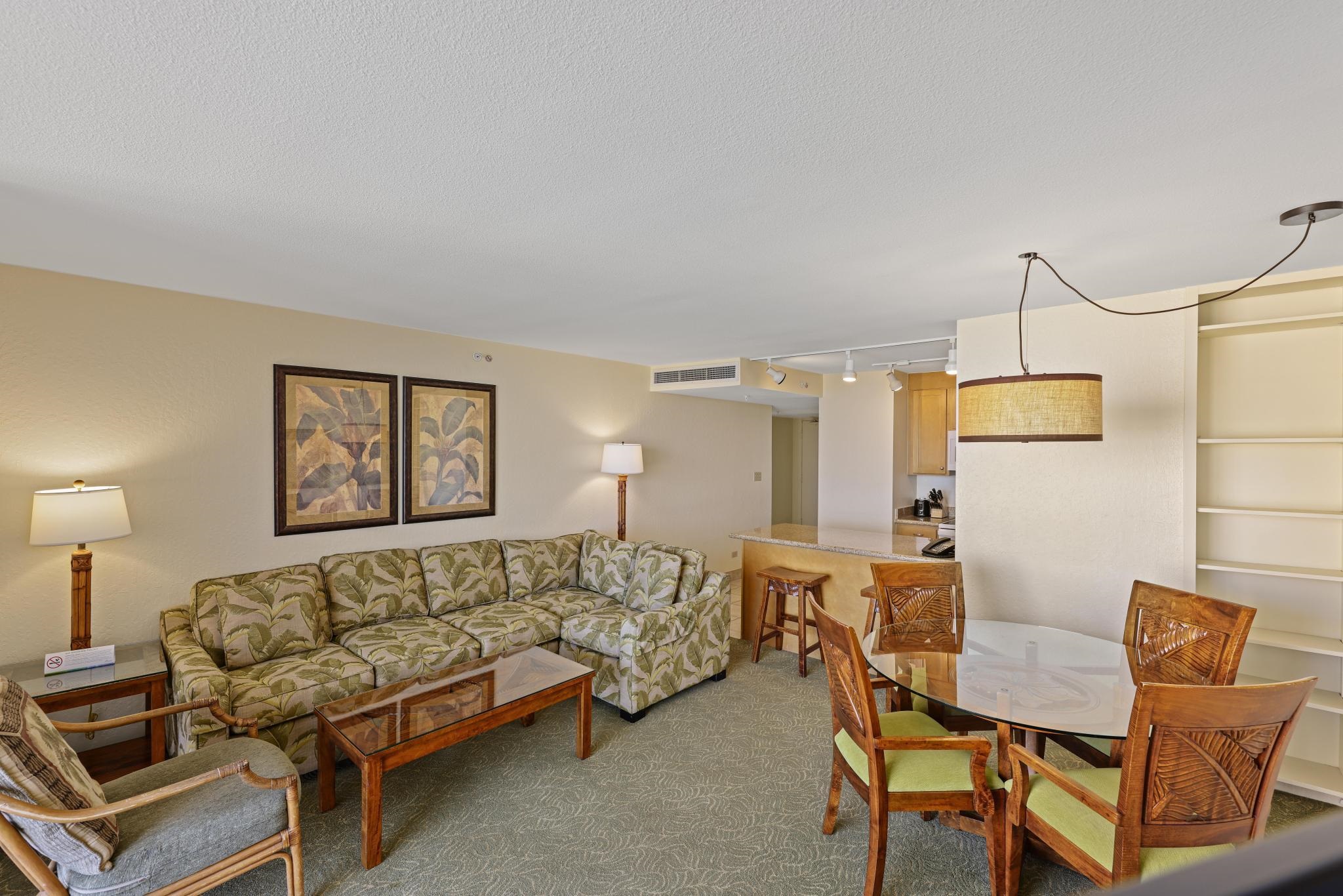 3445 Lower Honoapiilani Road, Unit 727 Lahaina, HI 96761 - Photo 8 of 42 a living room with furniture and a lamp