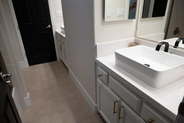 a bathroom with a sink and a mirror