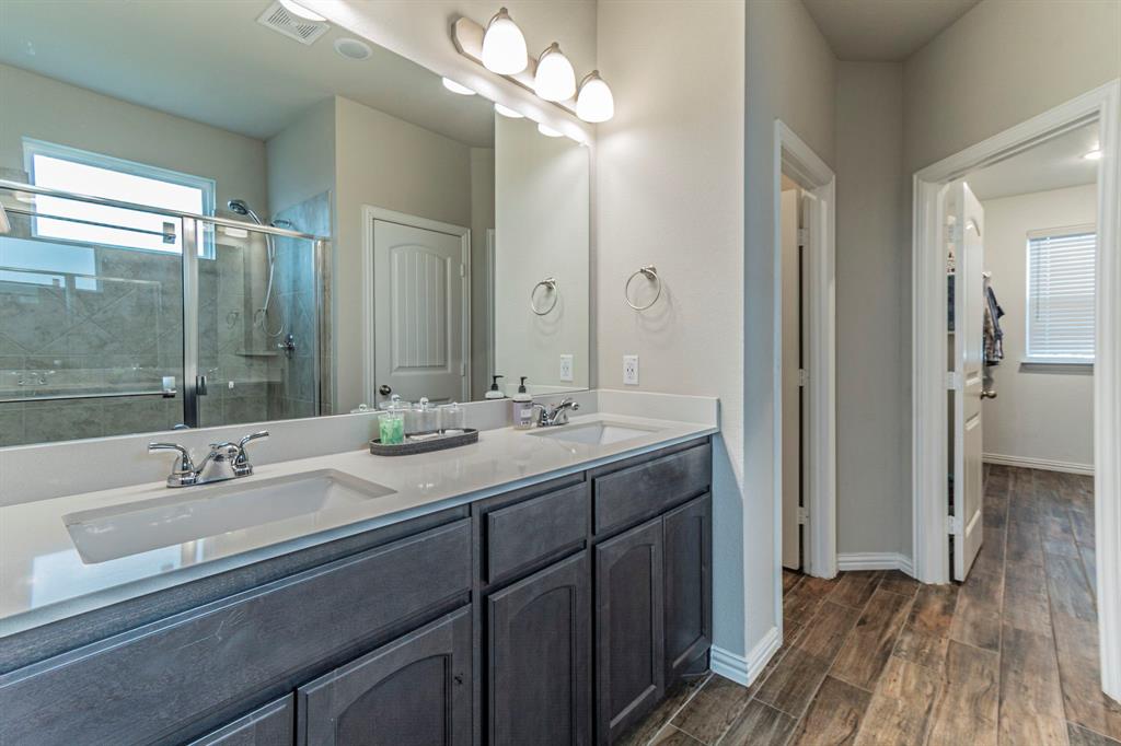 8432 Abner Road Terrell, TX 75161 - Photo 11 of 33 a bathroom with a double vanity sink mirror and double