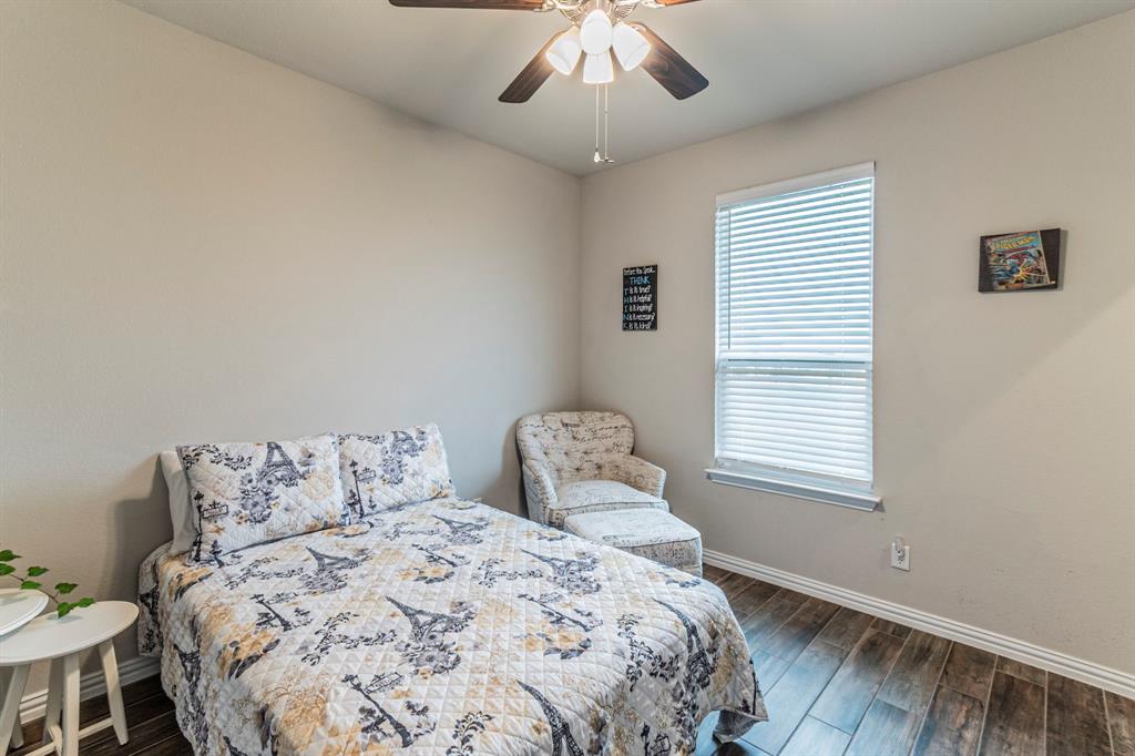 8432 Abner Road Terrell, TX 75161 - Photo 13 of 33 a bedroom with a bed and a window