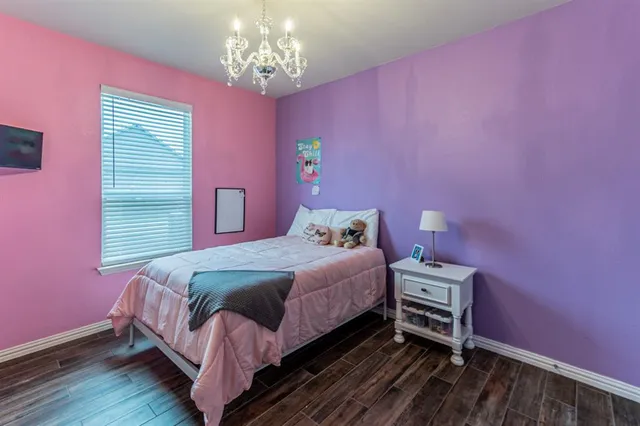 a living room with furniture and a book shelf