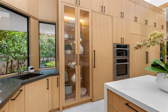 a kitchen with stainless steel appliances a refrigerator and a sink