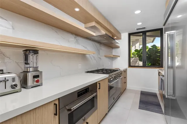 a kitchen with a stove and a refrigerator