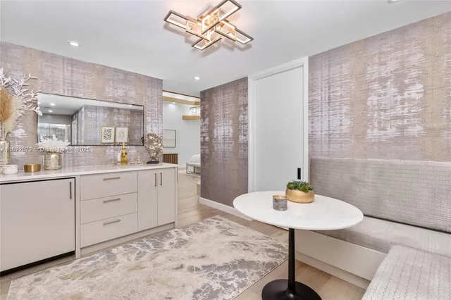 a spacious bathroom with a double vanity sink a mirror a bathtub and shower