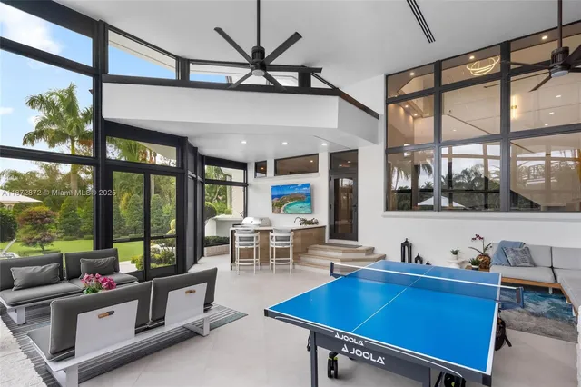 a view of a dining room with furniture large window and glass windows