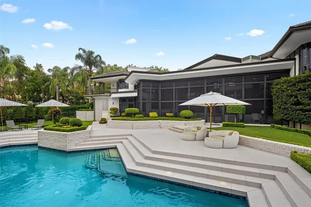 a front view of house with yard and outdoor seating