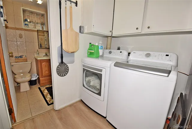a utility room with dryer and washer