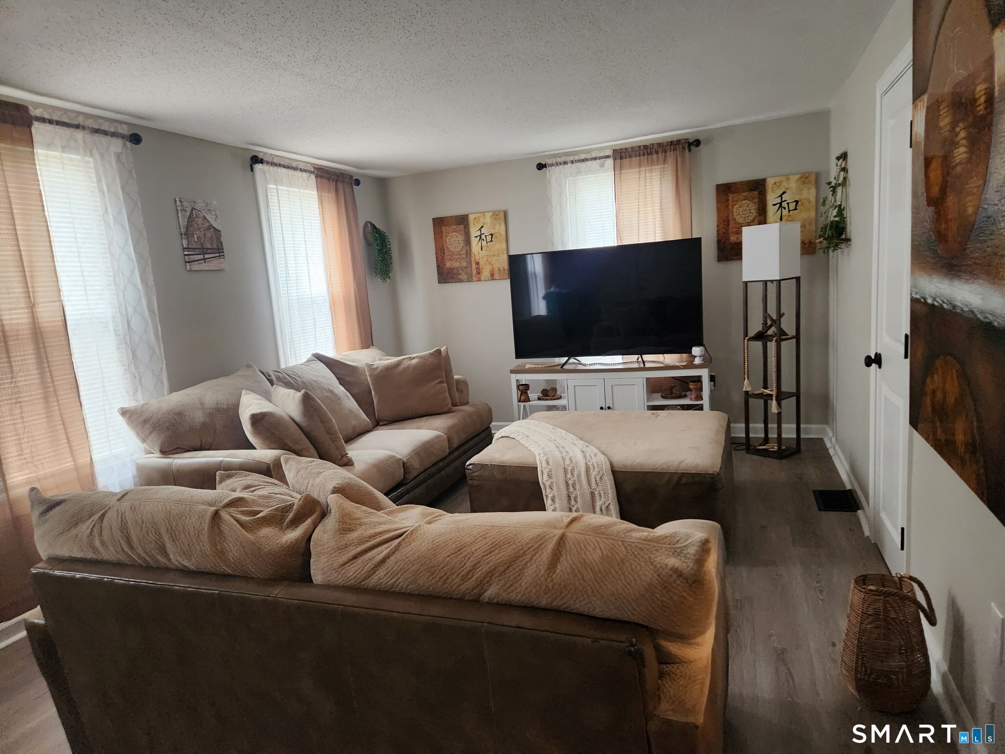 111-113 Sunset Avenue Meriden, CT 06450 - Photo 20 of 25 a living room with furniture and a flat screen tv