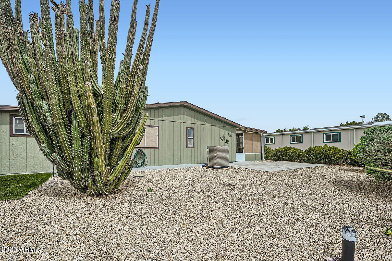 2400 East Baseline Avenue, Unit 94 Apache Junction, AZ 85119 - Photo 27 of 29 a house view with a outdoor space