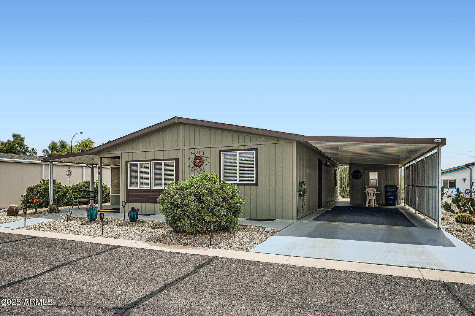 2400 East Baseline Avenue, Unit 94 Apache Junction, AZ 85119 - Photo 3 of 29 front view of a house with a patio