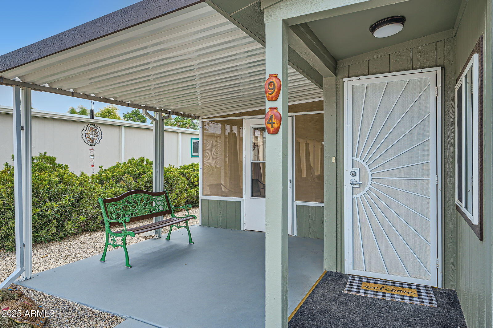 2400 East Baseline Avenue, Unit 94 Apache Junction, AZ 85119 - Photo 4 of 29 a outdoor view with glass door and outdoor seating