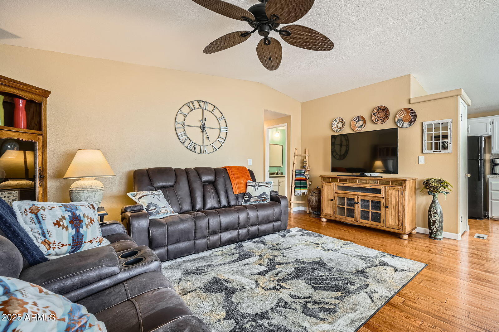 2400 East Baseline Avenue, Unit 94 Apache Junction, AZ 85119 - Photo 6 of 29 a living room with furniture and a flat screen tv