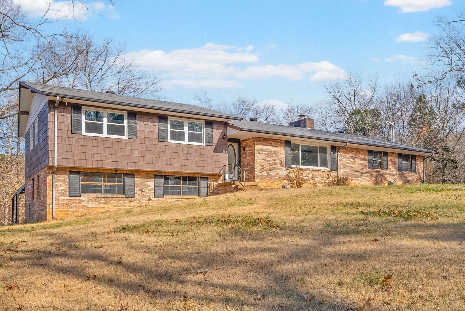103 Millers Hill Road Dover, TN 37058 - Photo 3 of 30 a front view of a house with a yard