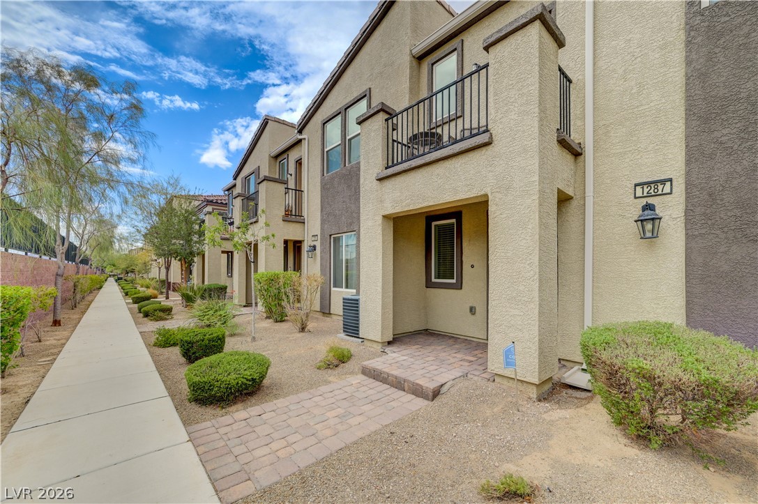 1287 Raritan Place Henderson, NV 89002 - Photo 2 of 21 A charming facade with a welcoming brick pathway leads to this appealing residence.