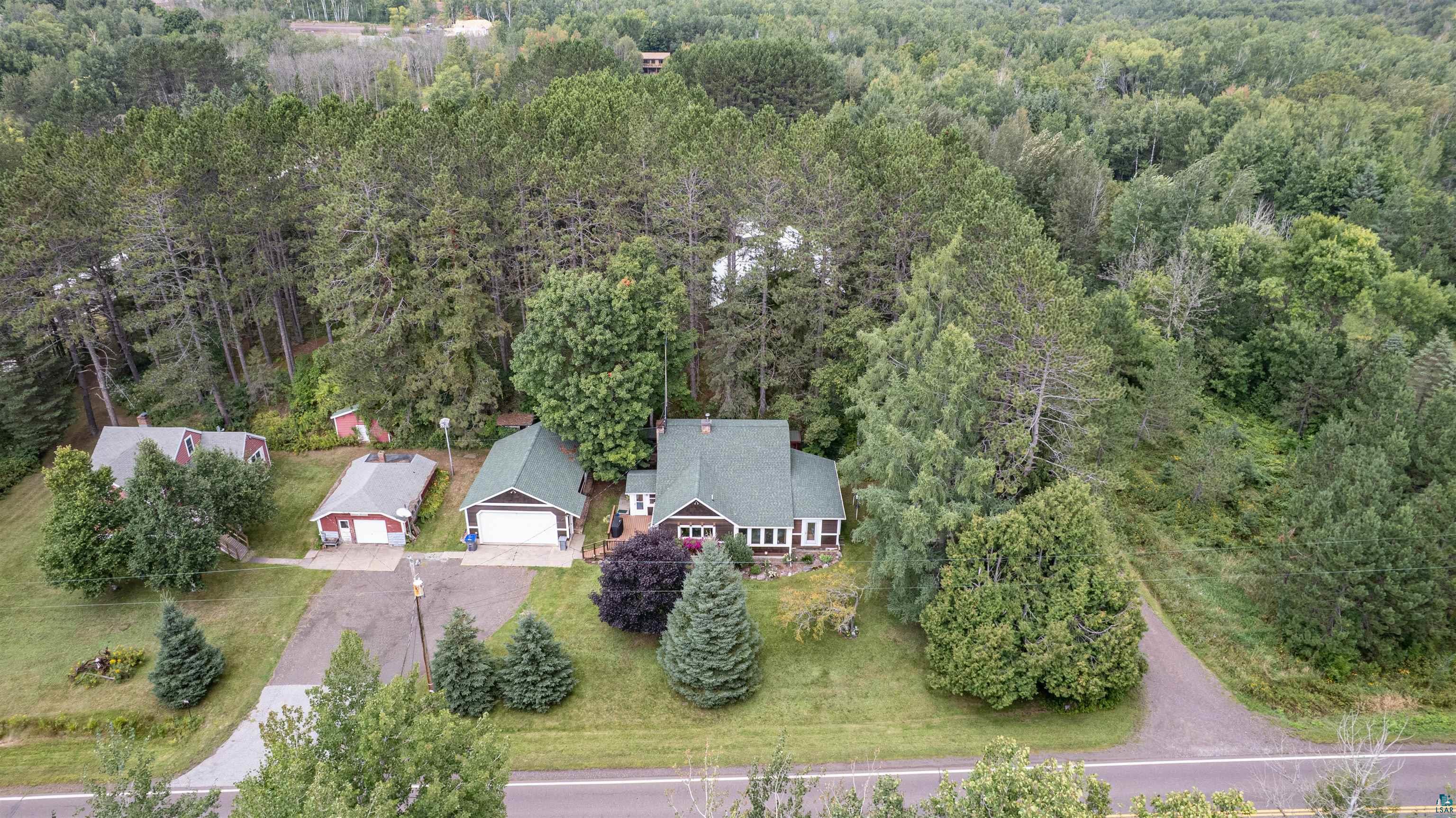 4793 Anderson Road Hermantown, MN 55811 - Photo 32 of 39 Aerial perspective showcasing a residential property surrounded by dense mature trees