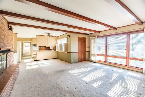 a view of a living room with a large window