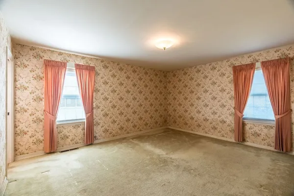 an empty room with windows