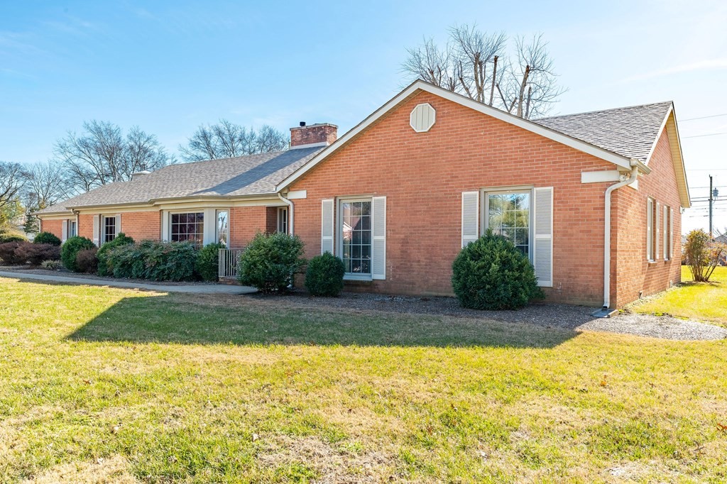 204 Ridgehill Drive Hopkinsville, KY 42240 - Photo 2 of 40 a front view of house with yard and swimming pool