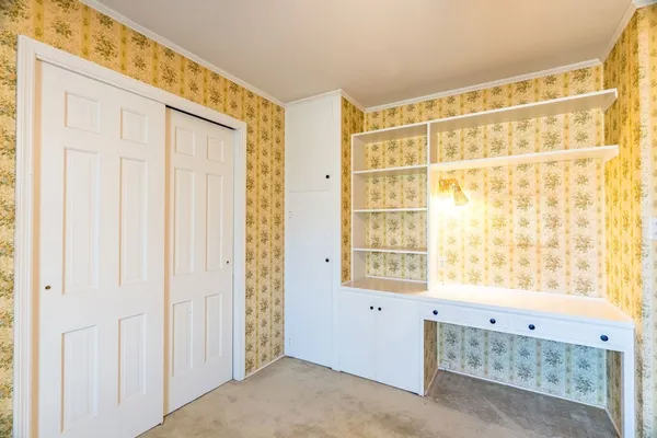 a bathroom with a sink shower and a mirror