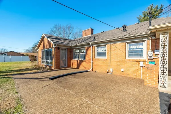 a view of a swimming pool and lounge chairs