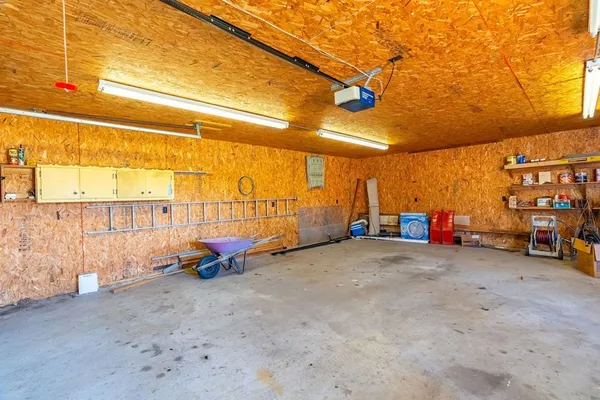 a view of a garage with a table and chairs
