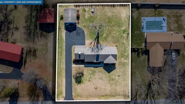 an aerial view of a house with outdoor space