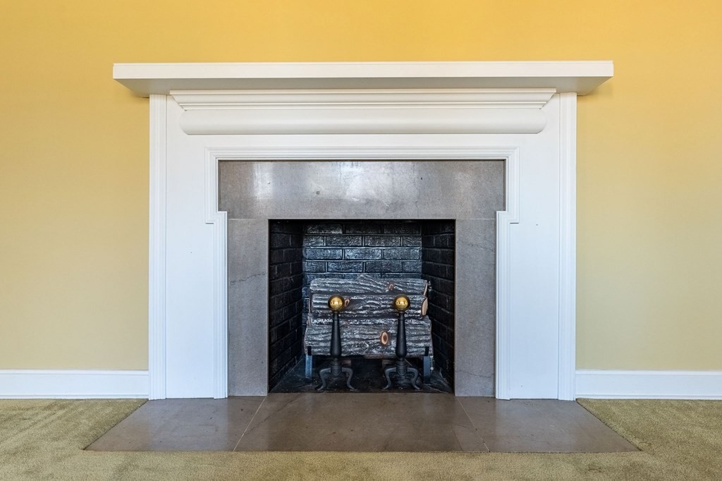 204 Ridgehill Drive Hopkinsville, KY 42240 - Photo 9 of 40 a view of an empty room with wooden floor and a fireplace