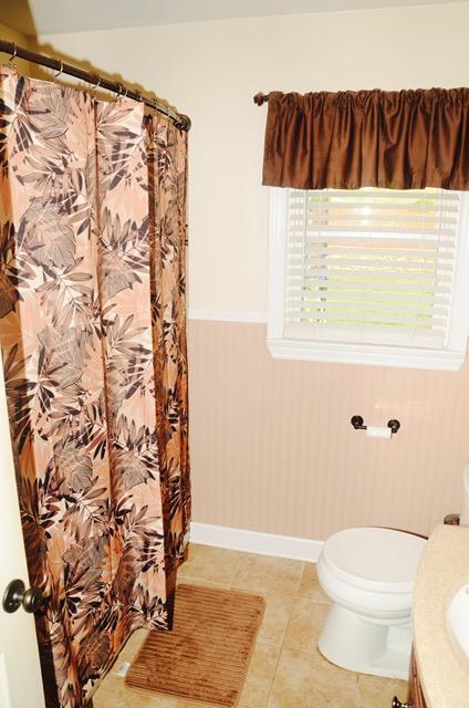 1874 Burma Road Salem, VA 24153 - Photo 11 of 19 a bathroom with a toilet and a shower curtain