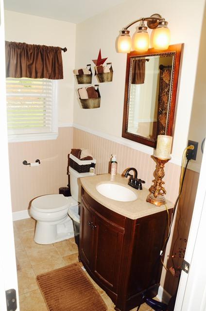1874 Burma Road Salem, VA 24153 - Photo 10 of 19 a bathroom with a sink mirror and toilet
