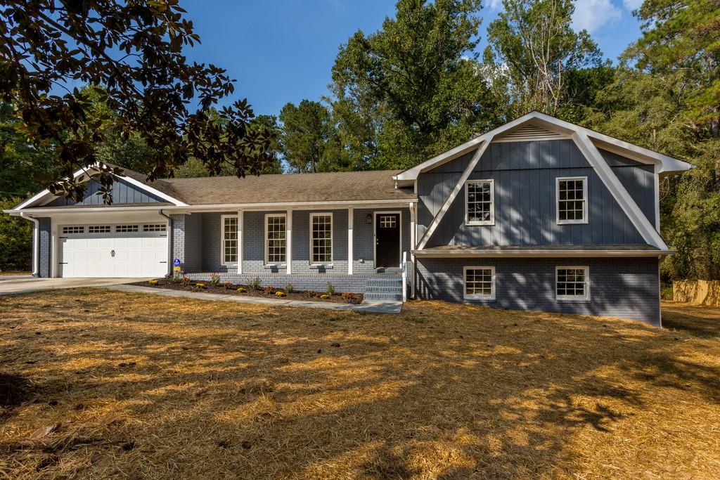 Beautifully renovated 4 Bedroom/3 Bath brick home on quiet, private 1 acre lot!