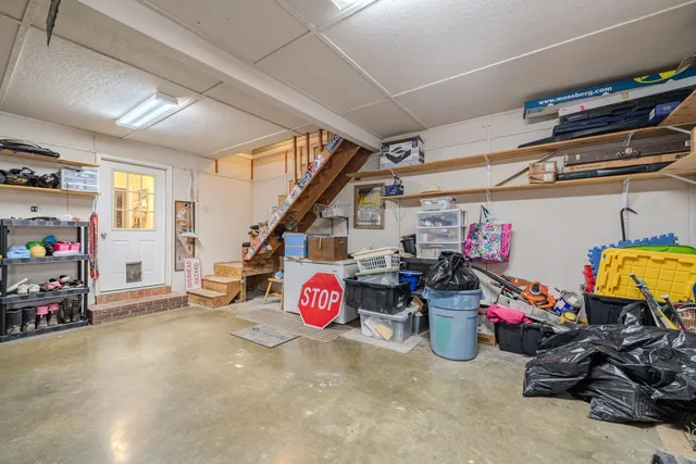 a view of a garage with a bike and car