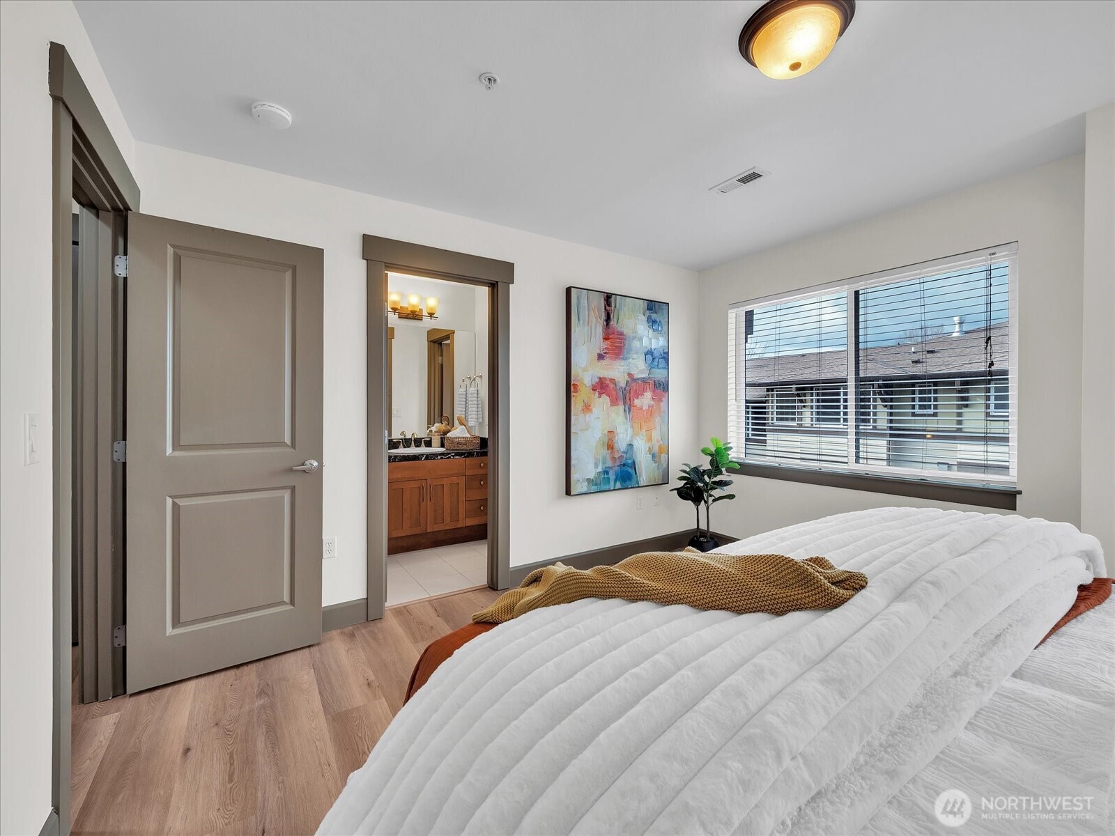 2115 201st Place Southeast, Unit K2 Bothell, WA 98012 - Photo 15 of 28 a bedroom with a bed and a large window