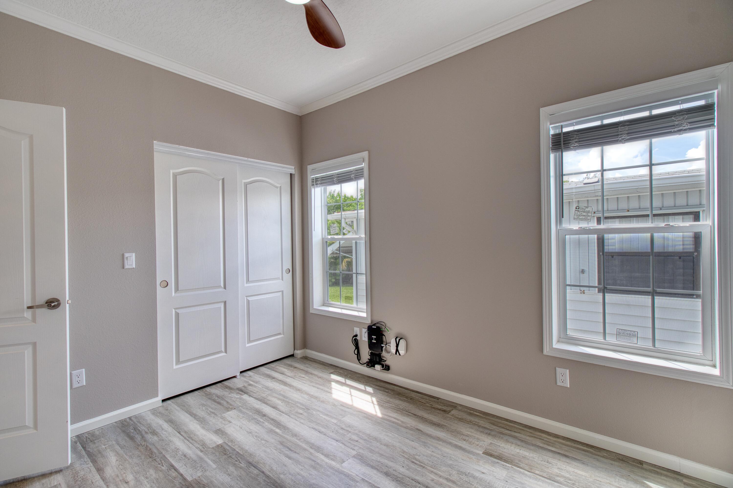 10701 South Ocean Drive, Unit 613 Jensen Beach, FL 34957 - Photo 11 of 64 an empty room with windows