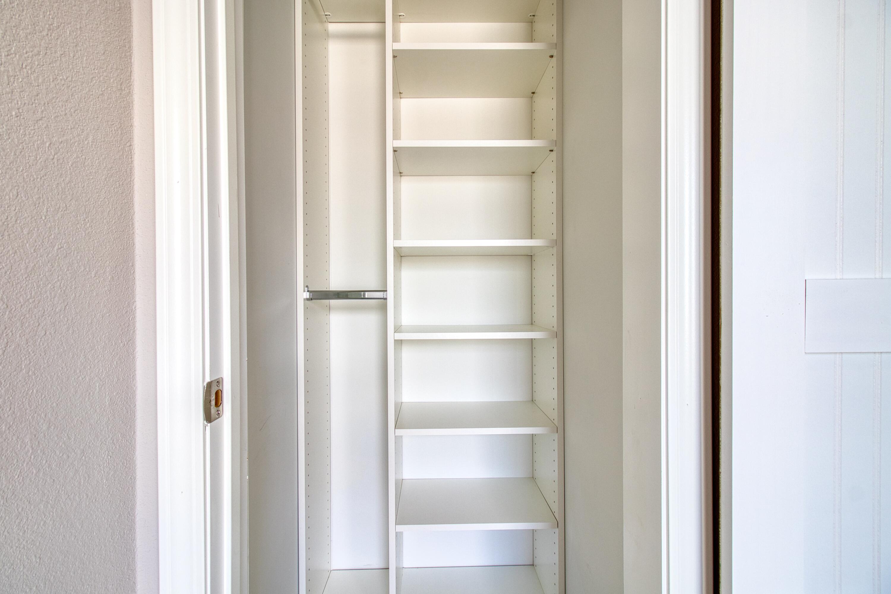 10701 South Ocean Drive, Unit 613 Jensen Beach, FL 34957 - Photo 18 of 64 a view of a walk in closet with empty racks